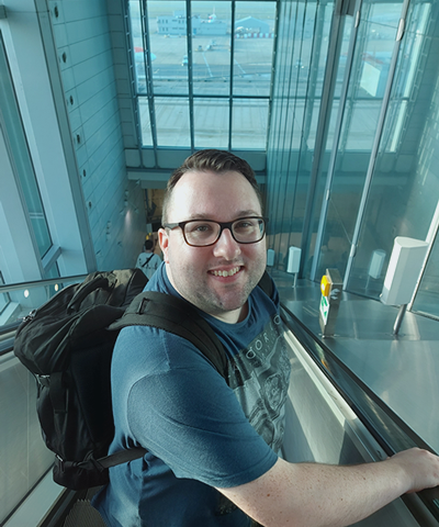 A picture of me at the airport, on the way to the departure gate!